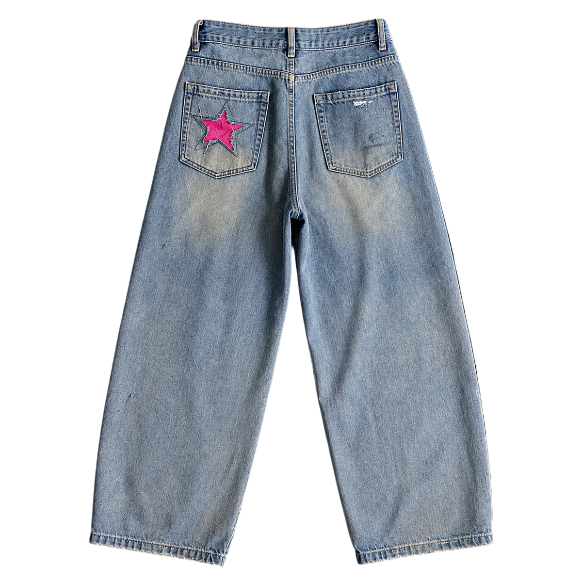 Light wash blue denim jeans shown from the back against a solid black background, featuring a bright pink embroidered star patch on the right back pocket.